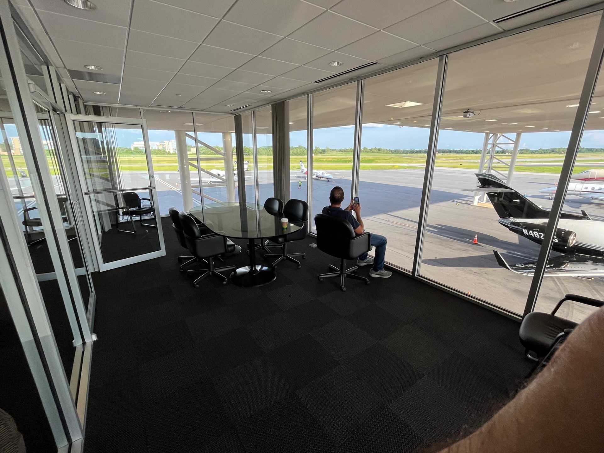 an office with floor to ceiling windows