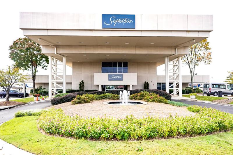 a sign in front of a building