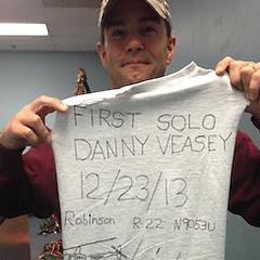 a person holding a shirt