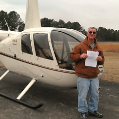 a man standing in front of a plane