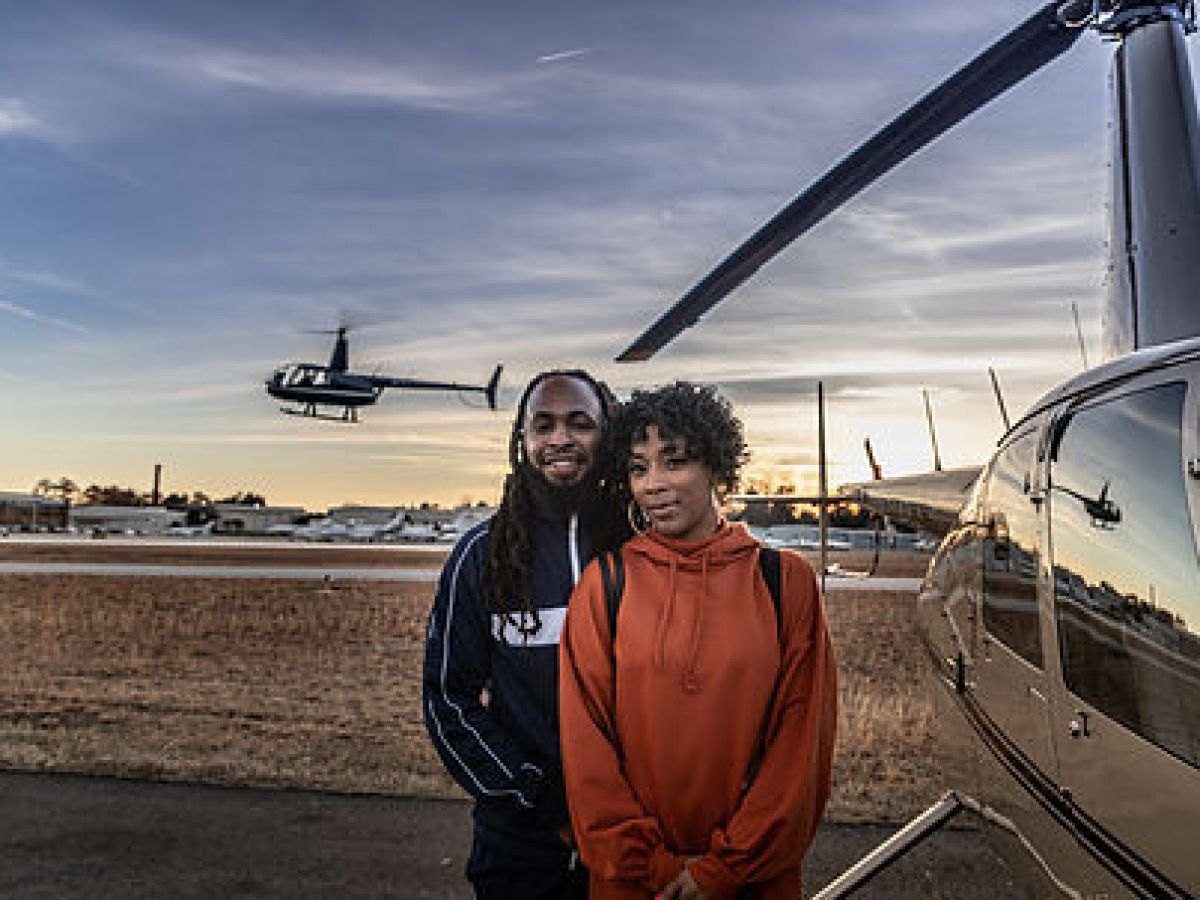 a man standing in front of a plane