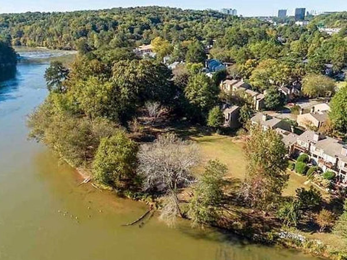 a large body of water surrounded by trees