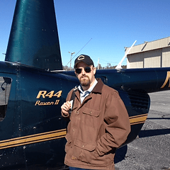 a man standing in front of a plane