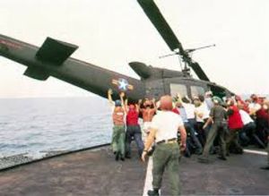 a group of people standing around a plane