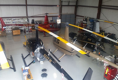 a room with a lot of helicopters