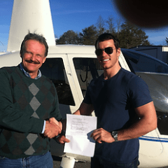 a man standing posing for the camera